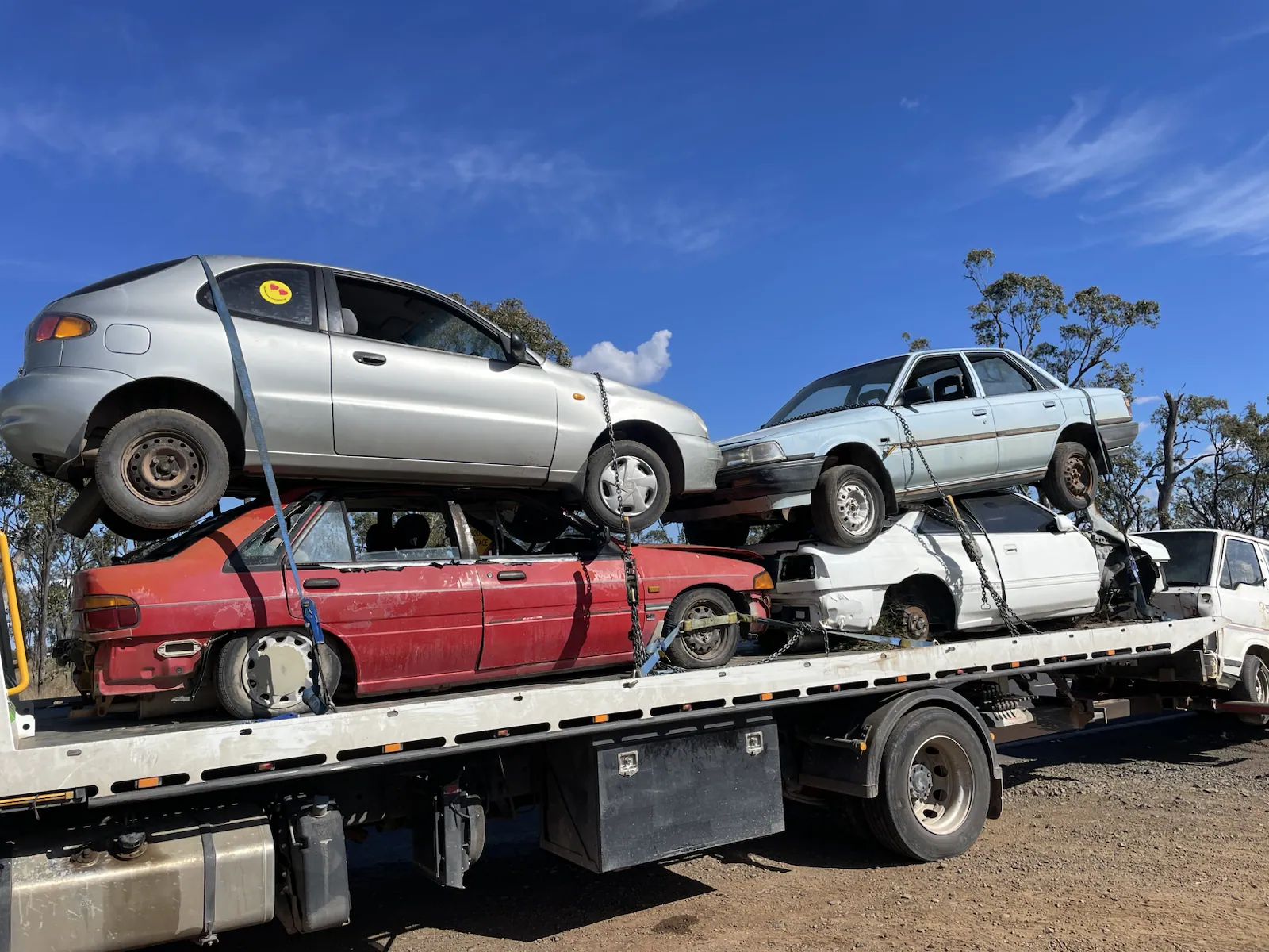 Stacked scrap cars loaded for recycling in Queensland